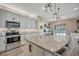 Bright kitchen featuring modern appliances and stylish backsplash at 6555 Kenava Loop, Palmetto, FL 34221