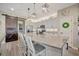 Bright kitchen with a large center island, granite countertops, and modern appliances at 6555 Kenava Loop, Palmetto, FL 34221