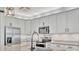 Bright kitchen featuring modern appliances and stylish backsplash at 6555 Kenava Loop, Palmetto, FL 34221