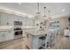 Bright kitchen with a large center island, granite countertops, and modern appliances at 6555 Kenava Loop, Palmetto, FL 34221