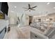 Spacious living room with hardwood floors, staircase, and open concept kitchen at 6555 Kenava Loop, Palmetto, FL 34221