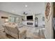 Cozy living room with a modern fireplace, a large TV, and comfortable seating at 6555 Kenava Loop, Palmetto, FL 34221