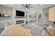 Cozy living room featuring a fireplace with TV and a comfortable seating area at 6555 Kenava Loop, Palmetto, FL 34221