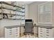 Close up of the home office with industrial shelving, storage, and natural light at 6555 Kenava Loop, Palmetto, FL 34221