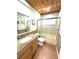 Bathroom features a granite vanity, glass shower door, and updated fixtures at 713 Rustic Oaks Dr, Palm Harbor, FL 34684