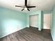 Bright bedroom with hardwood floors and a standard closet at 713 Rustic Oaks Dr, Palm Harbor, FL 34684