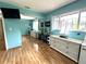 Stylish bedroom features a large mirror, hardwood floors, and a large window at 713 Rustic Oaks Dr, Palm Harbor, FL 34684