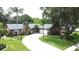 Charming single Gathering home with a well-manicured lawn and inviting curb appeal in a quiet neighborhood at 713 Rustic Oaks Dr, Palm Harbor, FL 34684