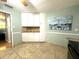 A well-lit kitchen with white cabinets, neutral backsplash, and diamond-pattern tile floor at 713 Rustic Oaks Dr, Palm Harbor, FL 34684