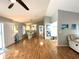 Spacious living room with an open floor plan, hardwood floors, and lots of natural light at 713 Rustic Oaks Dr, Palm Harbor, FL 34684
