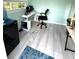 A clean and organized interior with desk, chair, and water cooler at 713 Rustic Oaks Dr, Palm Harbor, FL 34684