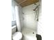 The tiled shower stall features a curtain, two shower heads, a wood ceiling, and tiled shelves at 713 Rustic Oaks Dr, Palm Harbor, FL 34684