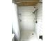 The tiled shower stall features a curtain, two shower heads, a wood ceiling, and tiled shelves at 713 Rustic Oaks Dr, Palm Harbor, FL 34684