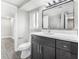 Contemporary bathroom with a vanity, marble countertop, new fixtures, and stylish flooring at 7607 New York Ave, Hudson, FL 34667