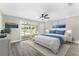 This bedroom features a sliding glass door and view to the pool outside at 7607 New York Ave, Hudson, FL 34667