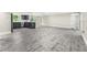 Spacious living area featuring new floors, modern fixtures, and fresh paint at 7607 New York Ave, Hudson, FL 34667