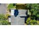 Aerial view showcasing the roof and surrounding greenery, providing a sense of the property's setting at 9027 Pebble Creek Dr, Tampa, FL 33647