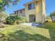Spacious backyard with a patio area and well-maintained lawn, offering a serene outdoor retreat at 9027 Pebble Creek Dr, Tampa, FL 33647