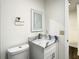 Bathroom features a toilet, sink with vanity, and modern fixtures at 9027 Pebble Creek Dr, Tampa, FL 33647