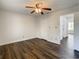 Empty bedroom boasting wood floors, a ceiling fan, and bright natural light at 9027 Pebble Creek Dr, Tampa, FL 33647