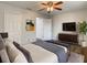 Bedroom with hardwood floors, ceiling fan, ensuite access, and closet at 9027 Pebble Creek Dr, Tampa, FL 33647
