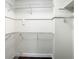 Walk-in closet featuring wire shelving and storage on all sides at 9027 Pebble Creek Dr, Tampa, FL 33647