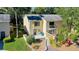 Charming townhome with a small balcony and well-maintained landscaping, offering a cozy curb appeal at 9027 Pebble Creek Dr, Tampa, FL 33647