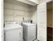 Laundry area with shelving, washer, and dryer at 9027 Pebble Creek Dr, Tampa, FL 33647