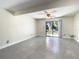 Bright living room with sliding glass doors that provide outdoor access and light at 9027 Pebble Creek Dr, Tampa, FL 33647