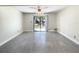 Bright living room with sliding glass doors that provide outdoor access and light at 9027 Pebble Creek Dr, Tampa, FL 33647