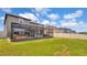 Spacious backyard with a screened in lanai at 9456 Channing Hill Dr, Sun City Center, FL 33573