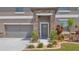 Attractive home features a stone accented entrance with lush landscaping and a three car garage at 9456 Channing Hill Dr, Sun City Center, FL 33573
