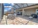 Spacious outdoor patio with brick flooring, comfortable seating, and an outdoor hot tub, ideal for relaxation and entertainment at 9456 Channing Hill Dr, Sun City Center, FL 33573