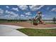 Neighborhood playground with swings, slide and play area at 9456 Channing Hill Dr, Sun City Center, FL 33573