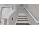 Staircase features white risers and dark wood treads at 9456 Channing Hill Dr, Sun City Center, FL 33573