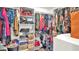 Organized walk-in closet with shelves, rods, and shoe storage at 9456 Channing Hill Dr, Sun City Center, FL 33573