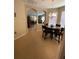 Inviting dining area with tile floors and archway leading to the living room at 11439 Cambray Creek Loop, Riverview, FL 33579