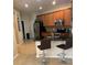 Kitchen with wood cabinets, stainless steel appliances, granite countertops, and breakfast bar with seating at 11439 Cambray Creek Loop, Riverview, FL 33579