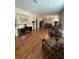 Open living room featuring hardwood floors, neutral walls, and modern furniture at 11439 Cambray Creek Loop, Riverview, FL 33579