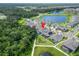 An aerial view showcasing a home's location near lush greenery and community amenities at 12928 Twin Bridges Dr, Riverview, FL 33579
