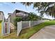 Charming fenced backyard with a covered screened-in patio and lush landscaping at 12928 Twin Bridges Dr, Riverview, FL 33579