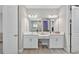 Bright bathroom featuring double vanity with white cabinets and a shower with glass doors at 12928 Twin Bridges Dr, Riverview, FL 33579