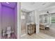 Modern bathroom with a tiled shower, toilet, and view into the bedroom at 12928 Twin Bridges Dr, Riverview, FL 33579