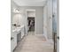 Spacious bathroom with double vanity, walk-in closet and tiled floors at 12928 Twin Bridges Dr, Riverview, FL 33579