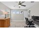 Home office featuring a ceiling fan, closet, and large window with lots of natural light at 12928 Twin Bridges Dr, Riverview, FL 33579
