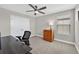 Comfortable bedroom features a ceiling fan, closet, and large window with lots of natural light at 12928 Twin Bridges Dr, Riverview, FL 33579