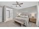 Comfortable bedroom with soft, neutral tones and a charming bench at the foot of the bed at 12928 Twin Bridges Dr, Riverview, FL 33579