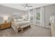 Serene bedroom with a ceiling fan, neutral tones, and bright natural light at 12928 Twin Bridges Dr, Riverview, FL 33579