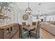 Open-concept dining area showcasing a modern chandelier and access to the gourmet kitchen at 12928 Twin Bridges Dr, Riverview, FL 33579