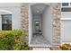 Welcoming entryway with a stone archway and tiled floor at 12928 Twin Bridges Dr, Riverview, FL 33579